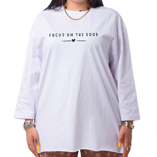 Woman wearing a white t-shirt with text on a white background