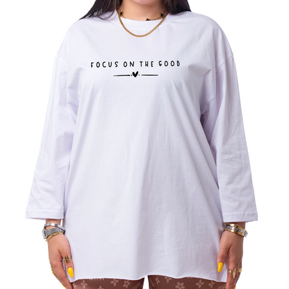 Woman wearing a white t-shirt with text on a white background